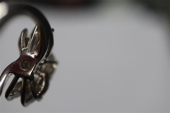An 18ct white metal and single stone diamond ring, with marquise cut diamond set shoulders, size H/I.